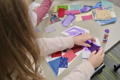 A child uses scrap fabric to make a Coat of Many Colors just like in Dolly Parton's song and book that is mailed to 4-year-olds.