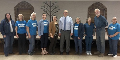 DCY Chief Government and External Affairs Officer Joel Potts with the board of directors of Mary's House in Morgan County