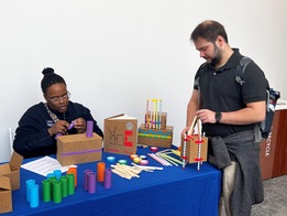 Two people participate in a STEAM activity at COSI Columbus.