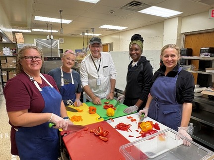 Farm to School Chef, Jim Warner, prepares Sweet and Spicy Rainbow Burrito recipe with Bexley City Schools food service staff.