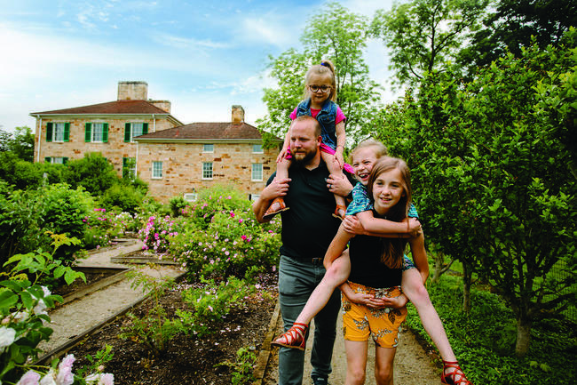 A family enjoying the outdoors at Adena Mension & Gardens historic site.