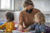 Teacher working with young children