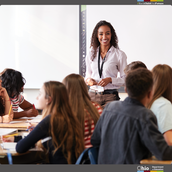 Teacher standing in front of classroom.