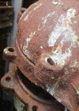 A well missing well cap bolts, creating an improper seal. 