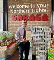 Auditor Stinziano awards the August True Transactions Award to the Saraga International Grocery Store