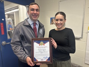 Auditor Stinziano presents the TTA certificate to Loupas Waffles.