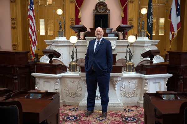 Rep. Click standing in the House Chamber