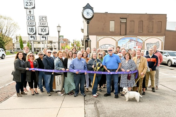Rep. Click at a ribbon cutting event for a farmers market