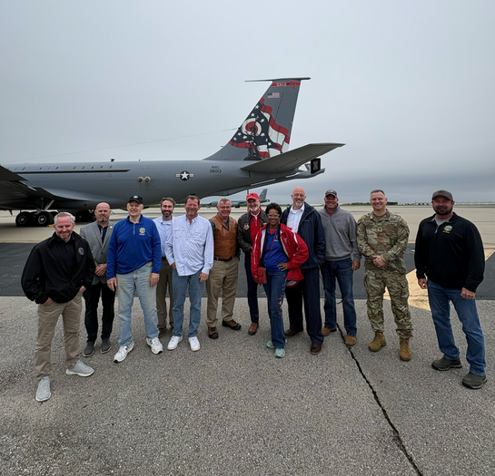 Members of the Ohio House in front of an Air Plane