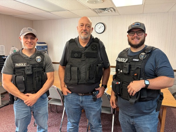 Rep. Click and two police officers