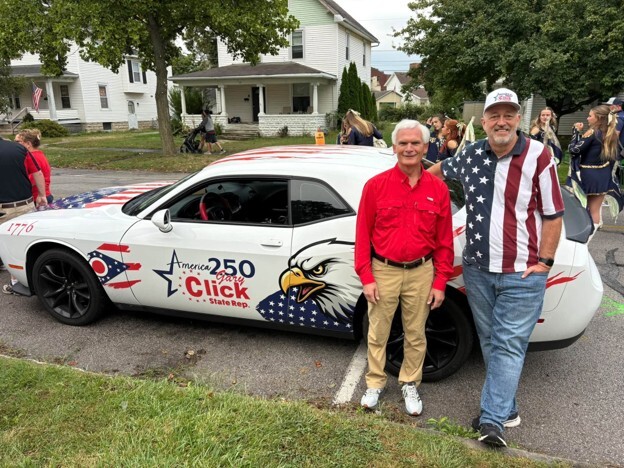 Rep. Click standing with his car and a constituent