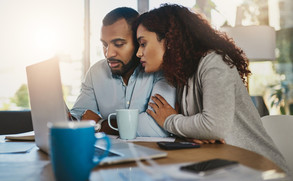 picture of young couple looking at computer