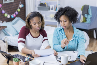 picture of mother and daughter looking at computer