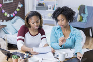 picture of mother and daughter looking at computer