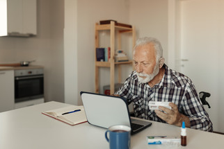 man looking at computer