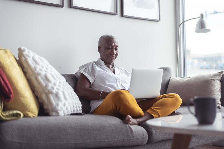 picture of lady on couch with laptop