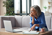 picture of woman looking at computer