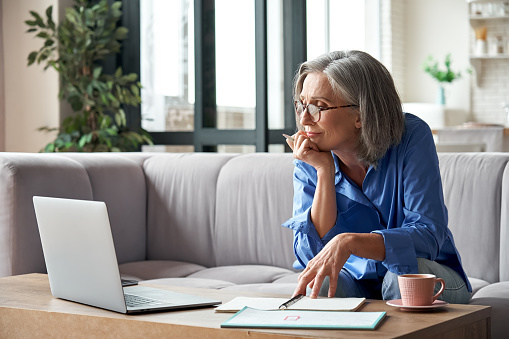 picture of woman looking at computer