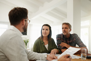 couple meeting with insurance agent pic