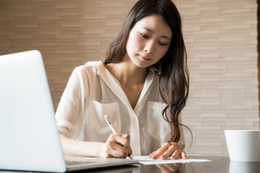 picture of woman typing on computer