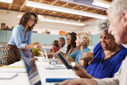 older adults at a medicare informational event