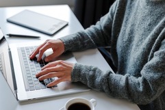 person typing on laptop