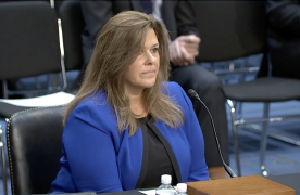 Director Reeg testifying before Senate