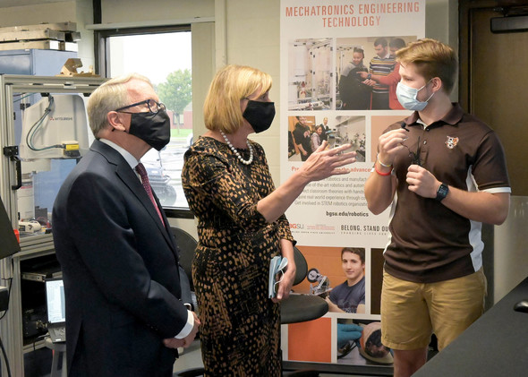 Governor DeWine and First Lady DeWine listen to a student while on a tour of Bowling Green State University.