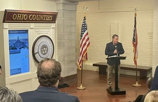 Lt. Governor Husted speaks at the dedication of the Statehouse's new interactive counties exhibit. 