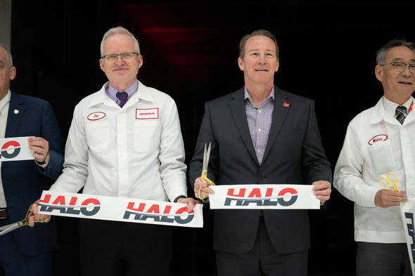 Lt. Governor Husted holds up the newly cut ribbon at the grand opening for Honda Automotive Laboratories of Ohio.