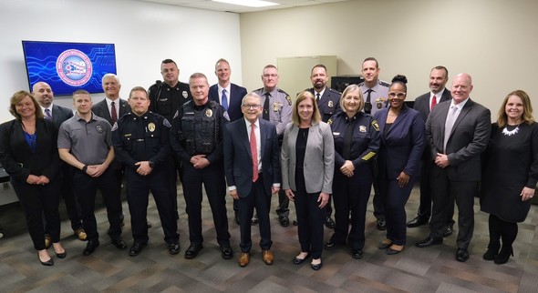 Governor DeWine pictured with members of law enforcement at the new Ohio Narcotics Intelligence Center.