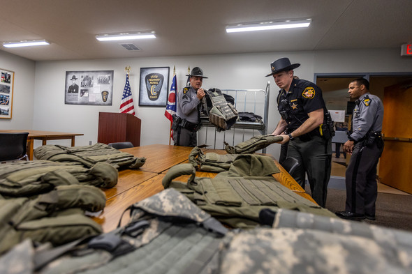 Ohio State Highway Patrol Officers help take inventory of personal protective gear  with Union County Sheriff's Office.