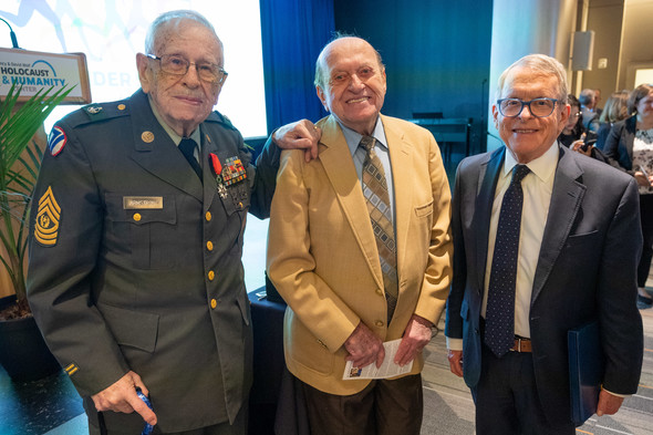 Governor DeWine stands alongside Conrad Weiner and Henry Armstrong.