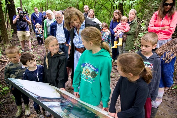 First Lady Fran DeWine shares the featured story during a walk through the new Storybook Trail at Cowan Lake State Park.