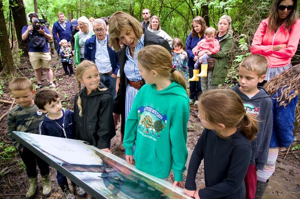 First Lady DeWine shares the featured story with kids during a walk through the new Storybook Trail at Cowan Lake State Park.