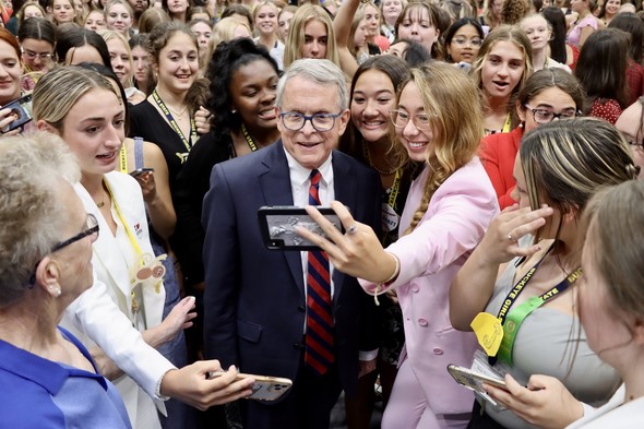 Governor DeWine poses with members of the Buckeye Girls State during his visit to Alliance, Ohio.