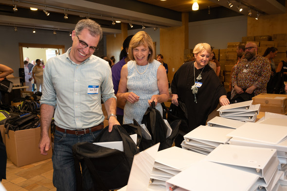 First Lady DeWine fills up a backpack with school supplies.