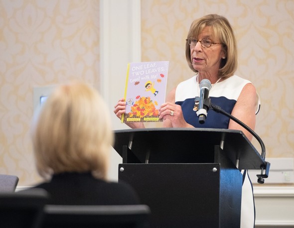 First Lady Fran DeWine holds up "One Leaf, Two Leaves, Count with Me!" by John Micklos Jr.