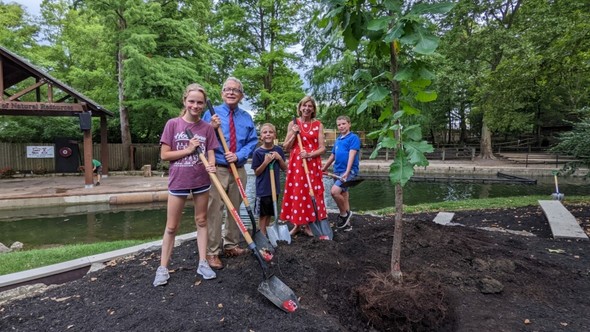 Governor DeWine and First Lady DeWine plant a Bur Oak tree with their grandkids at the Ohio State Fair.