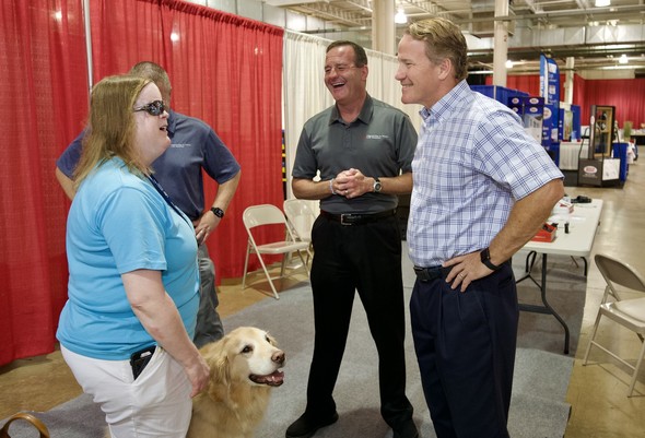 Lt. Governor and Executive Director of Opportunities for Ohioans with Disabilities Kevin Miller speak with an Ohioan 