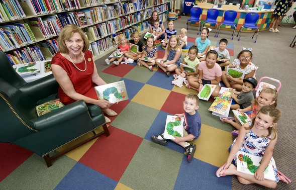 First Lady Fran DeWine smiles with kids at the St. Clairsville Library after a book reading to promote Dolly Parton's Imagination Library of Ohio.