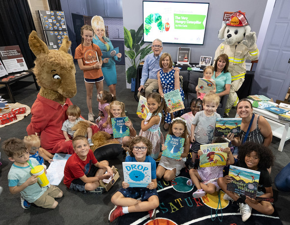 The First Lady, Governor DeWine, and Department of Commerce Director Sherry Maxfield pose with kids at the Fair after a book reading.