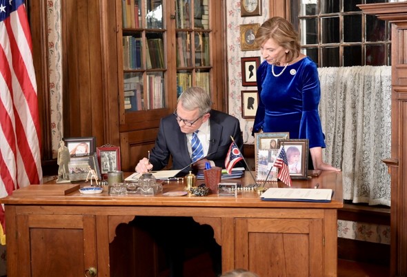 Ohio Governor Mike DeWine signing executive orders on January 8, 2023.