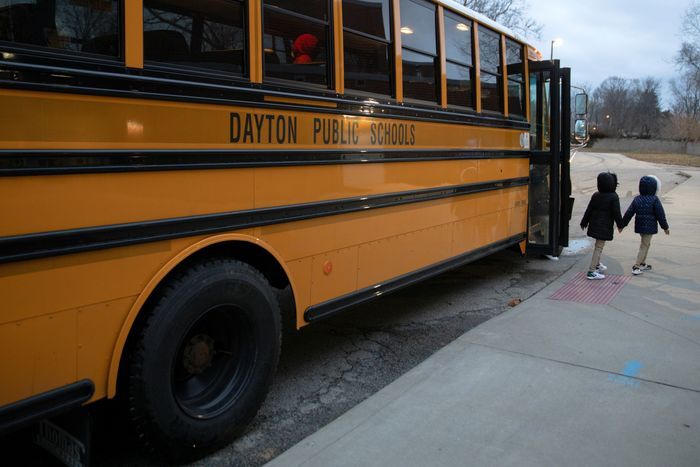 A bus drops students off at an elementary school in Dayton, Ohio