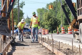 Construction workers working on road