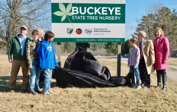 Governor DeWine and First Lady DeWine unveil new sign for the Buckeye State Tree Nursery. 