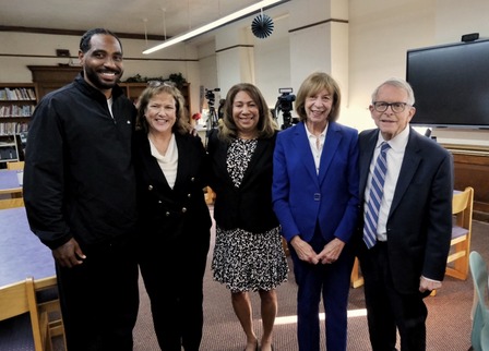Governor and First Lady DeWine and others posing together after touring the Braxton Miller Springfield Sports Academy.