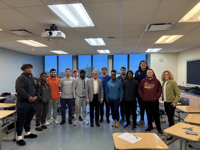 Lt. Governor Tressel posing with Professor Julie Jones and her Sport Organization class at the University of Akron.