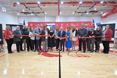 Ohio Governor Mike DeWine and First Lady DeWine helping to cut the ribbon on Fairfield Local School District's new school-based health clinic. 