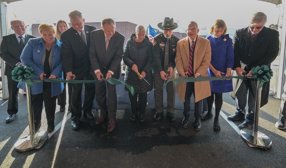 Governor and First Lady DeWine helping to cut the the ribbon for the new Greene County Gene Fischer Justice Center. 